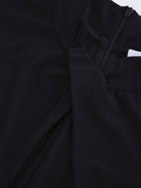 Close-up of a black garment with a textured fabric texture.