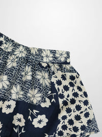 Navy and white floral patterned fabric on a white background