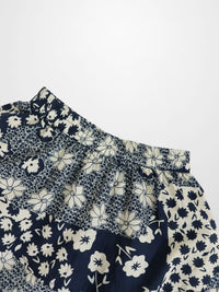 Navy and white floral patterned fabric on a white background