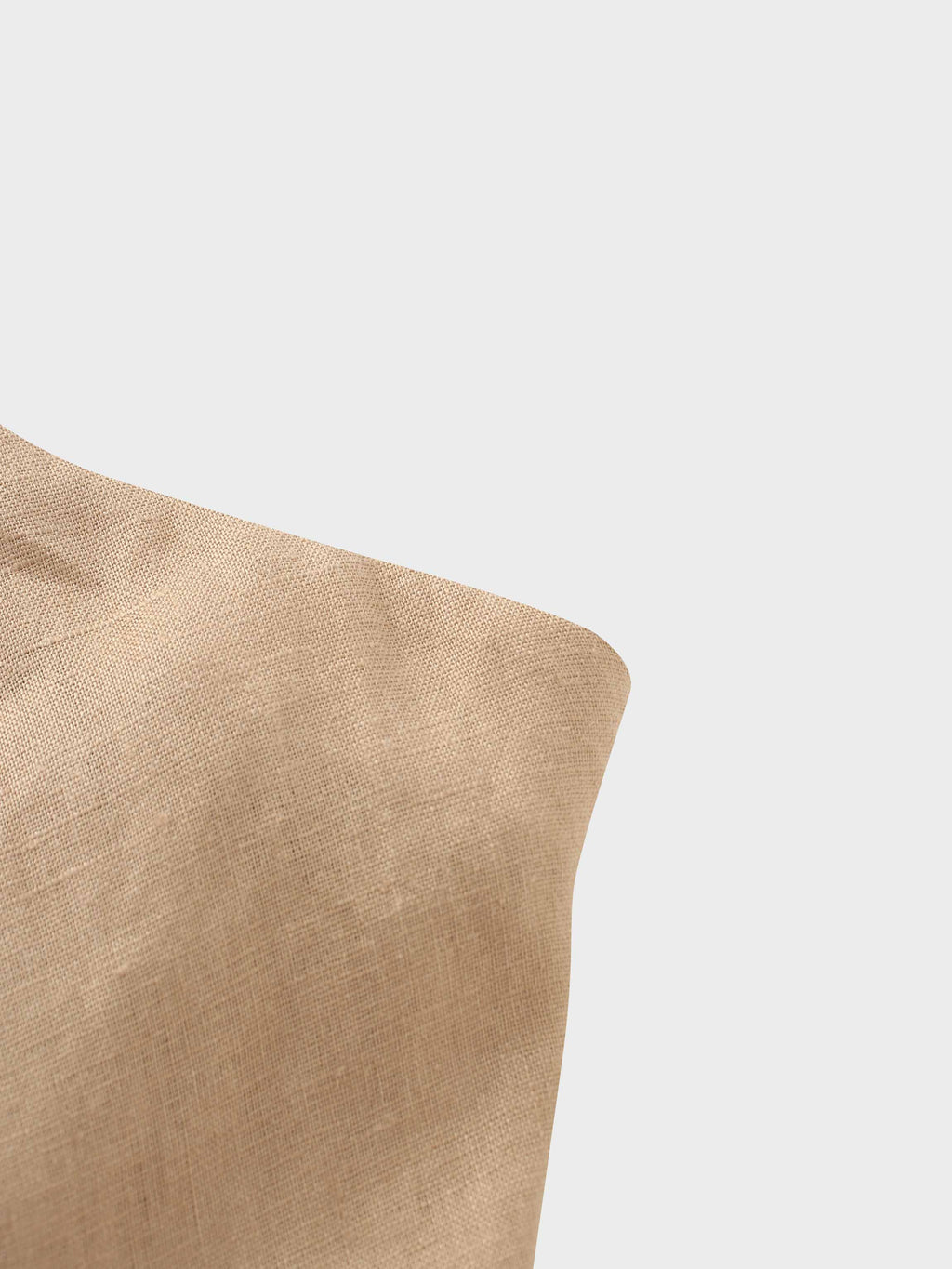 Beige cushion on a white background