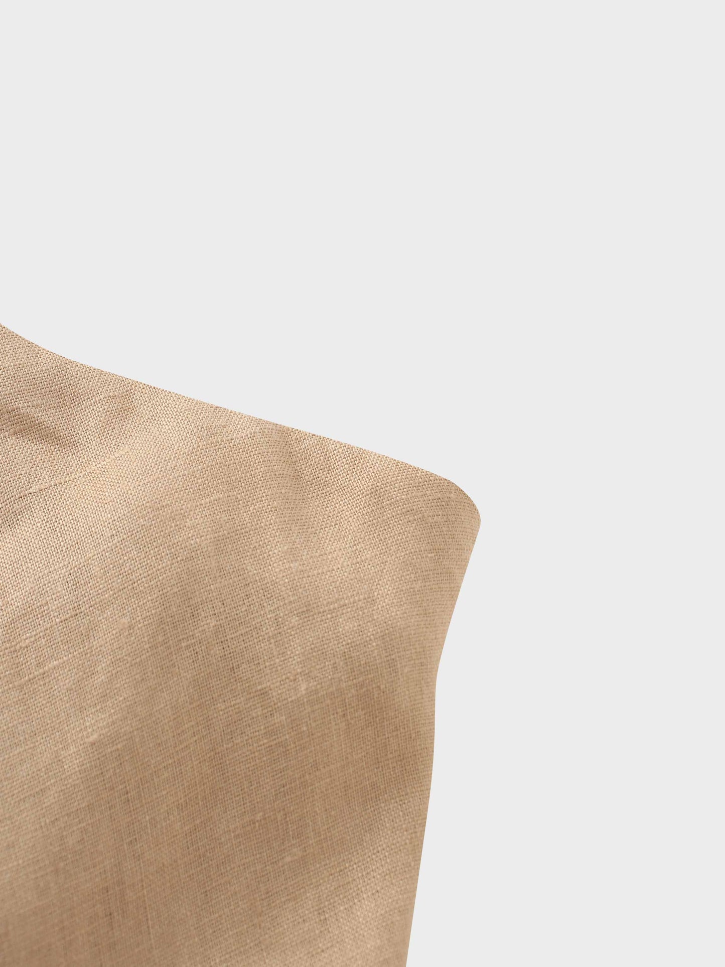 Beige cushion on a white background