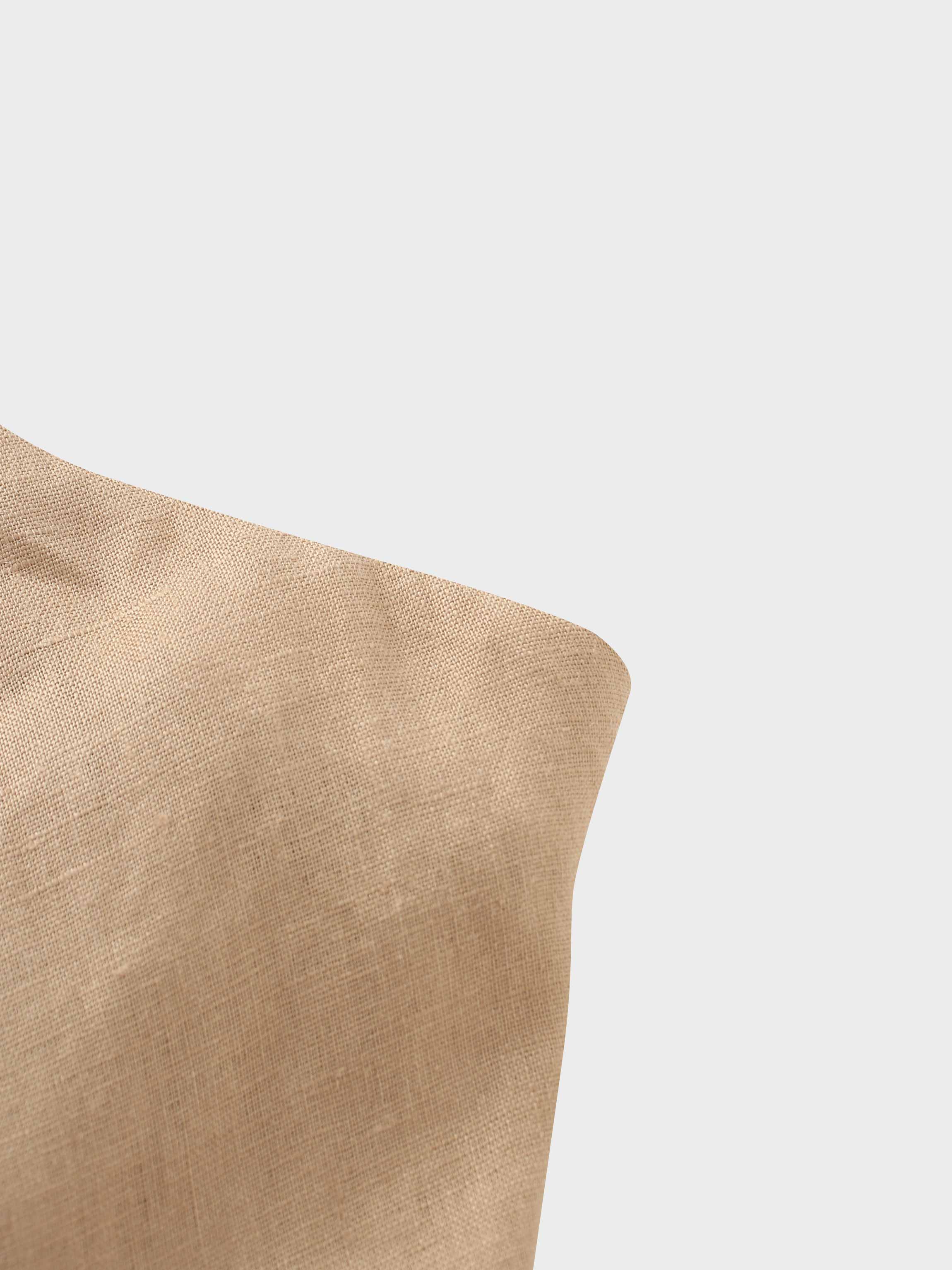 Beige cushion on a white background