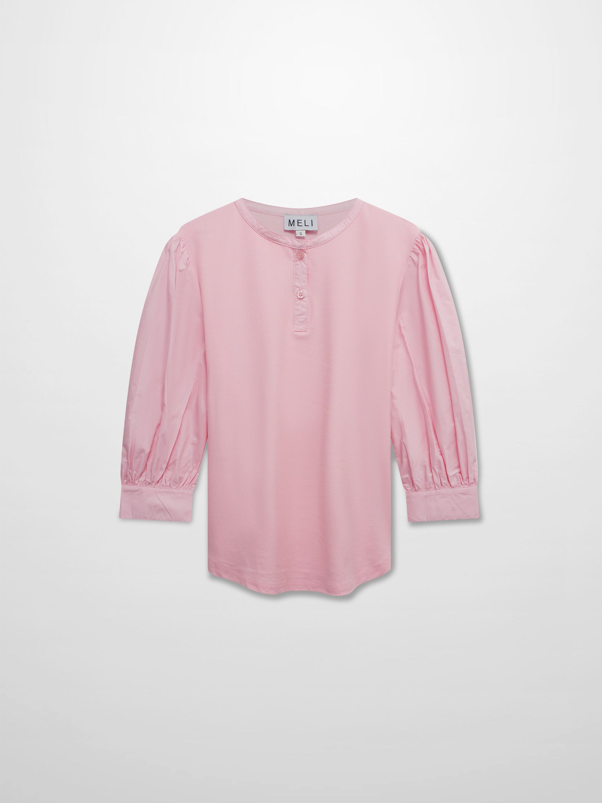 Pink blouse with long sleeves on a light gray background