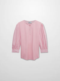 Pink blouse with long sleeves on a light gray background