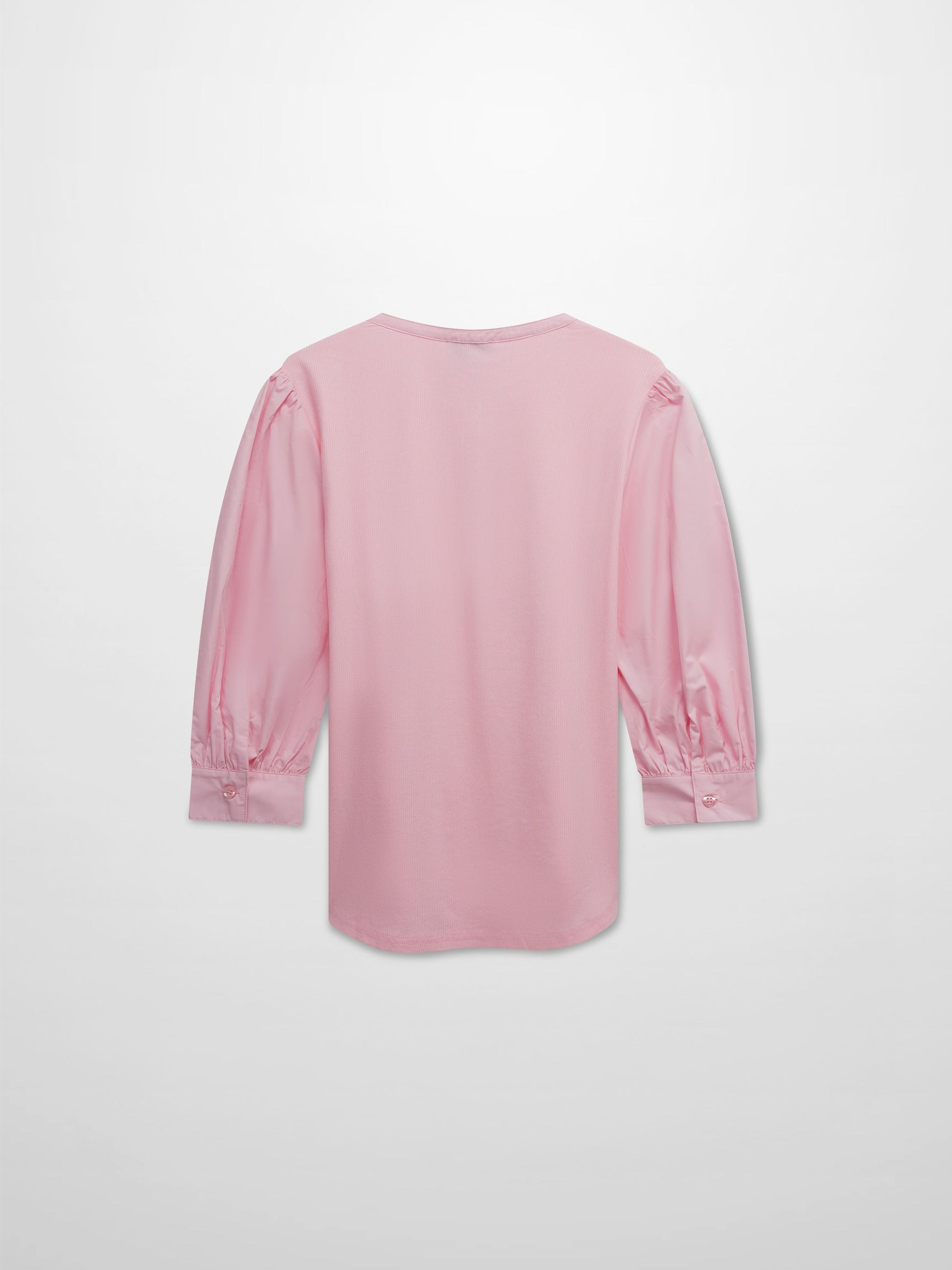 Pink long-sleeve top on a light gray background
