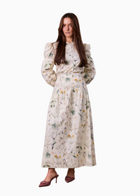Woman wearing a floral dress on a white background
