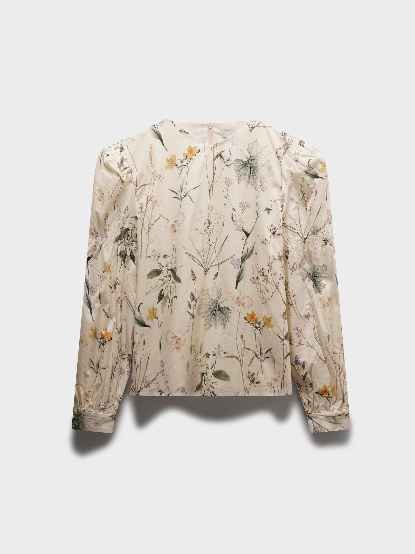 Floral patterned blouse on a light gray background