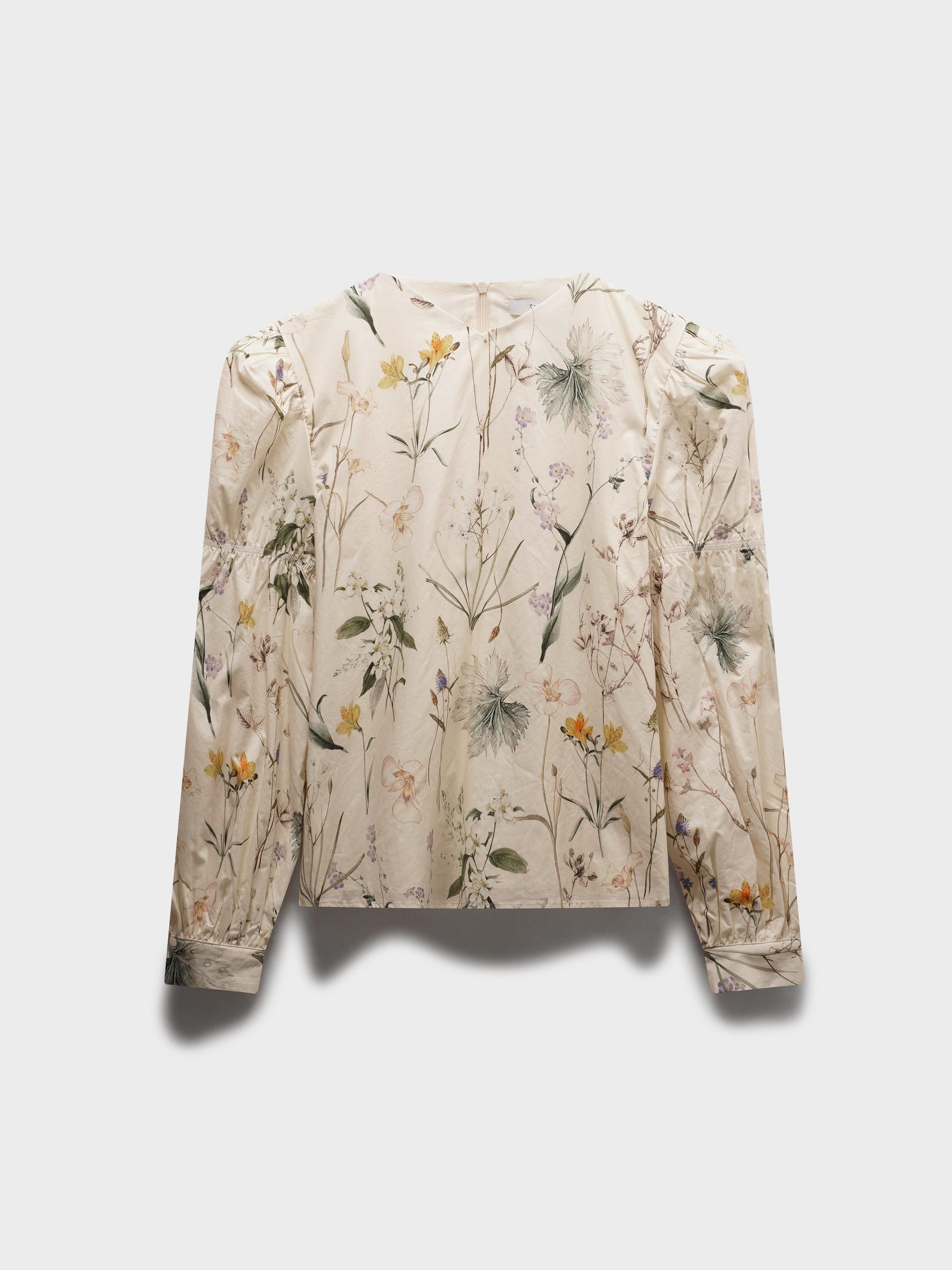Floral patterned blouse on a light gray background