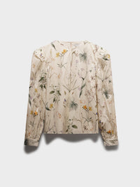 Floral patterned blouse on a light gray background