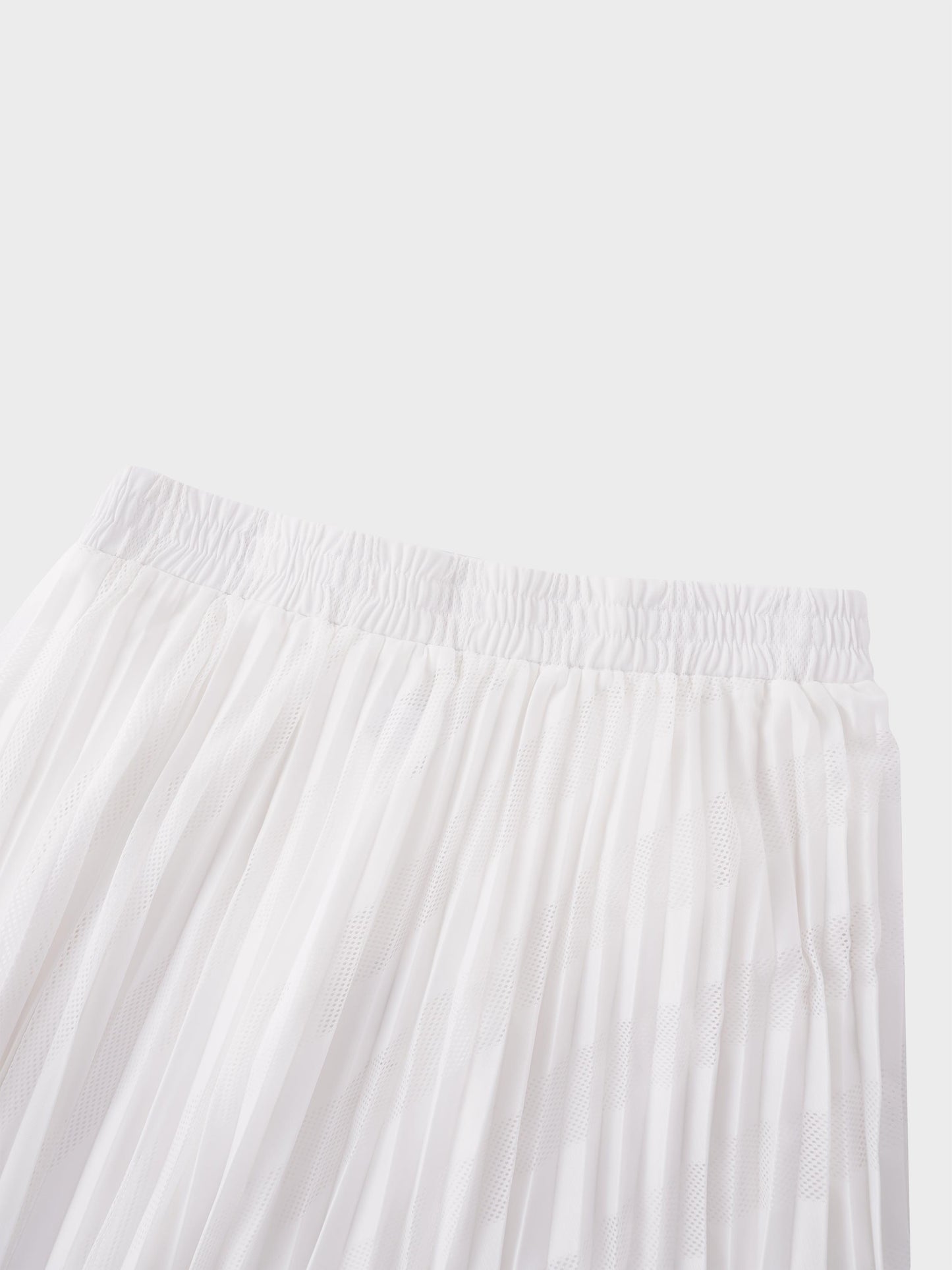 White pleated skirt on a light gray background