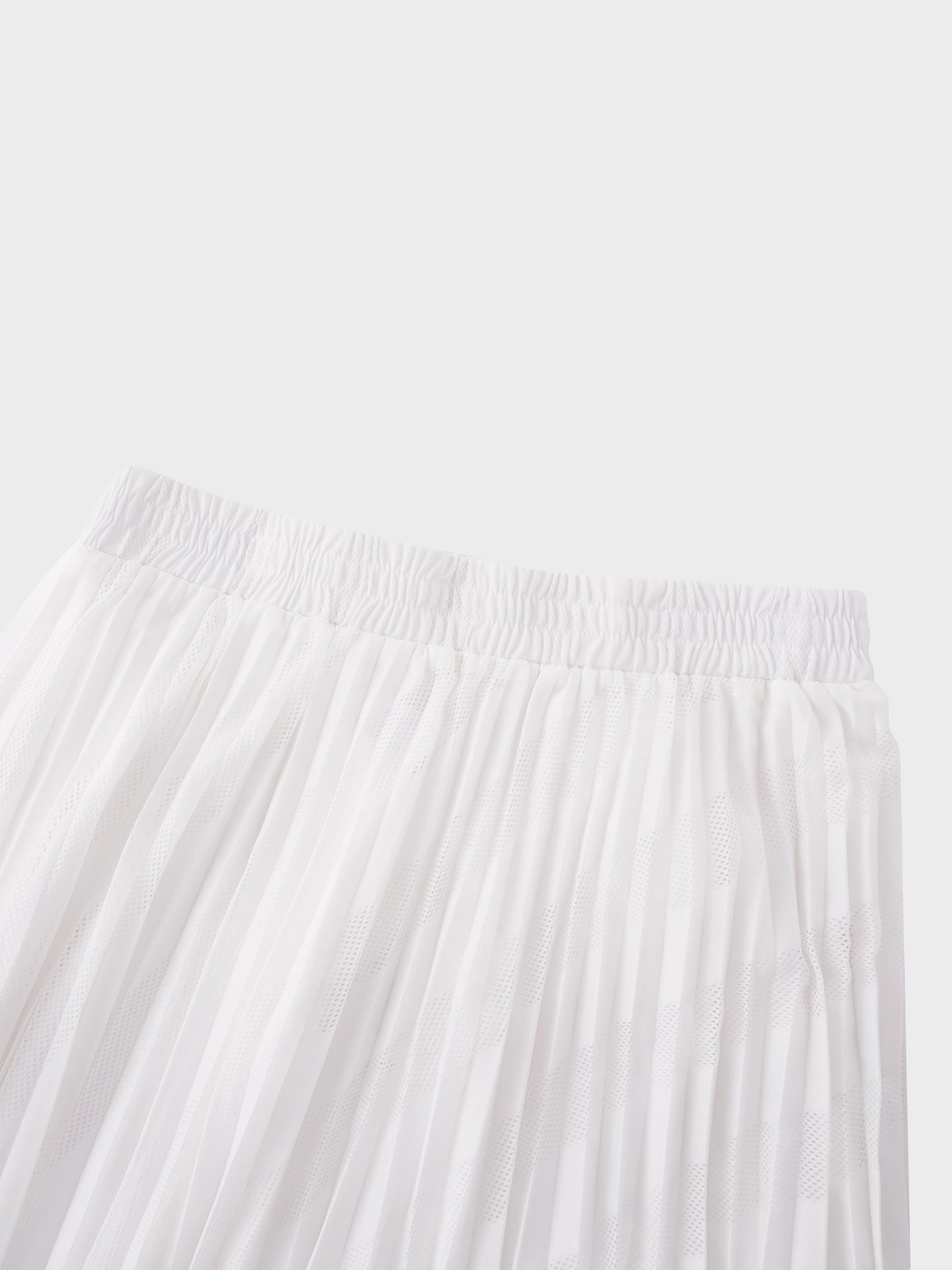 White pleated skirt on a light gray background